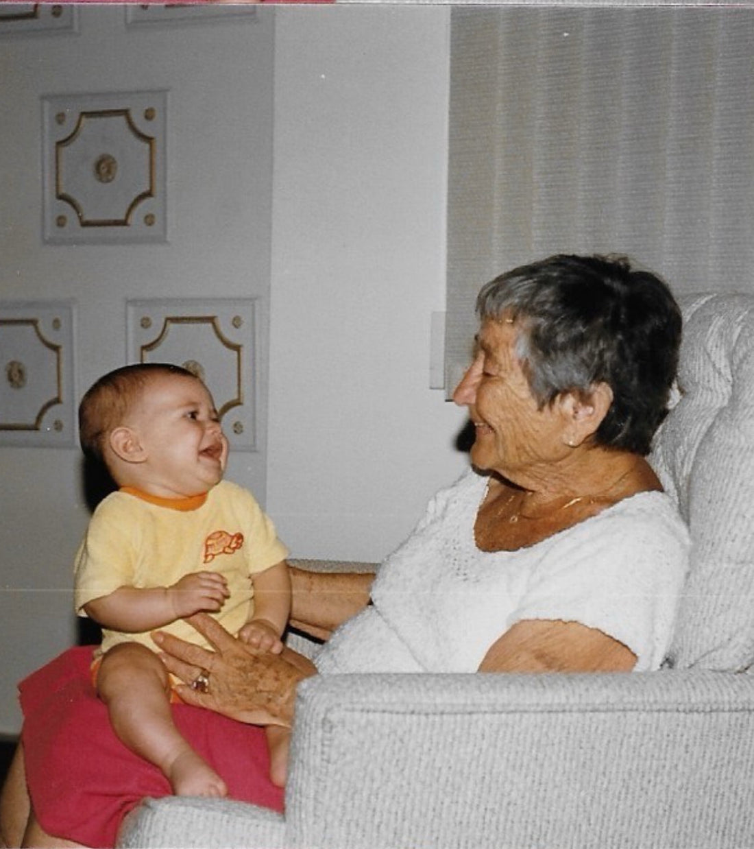 Grandma Jeanne holding a baby, the great-grandmother whose handwritten mandel bread recipe started Lazar Family Bakehouse